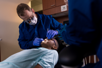 Dr. Burton, DDS, with patient at the Livestock Exchange Health campus.