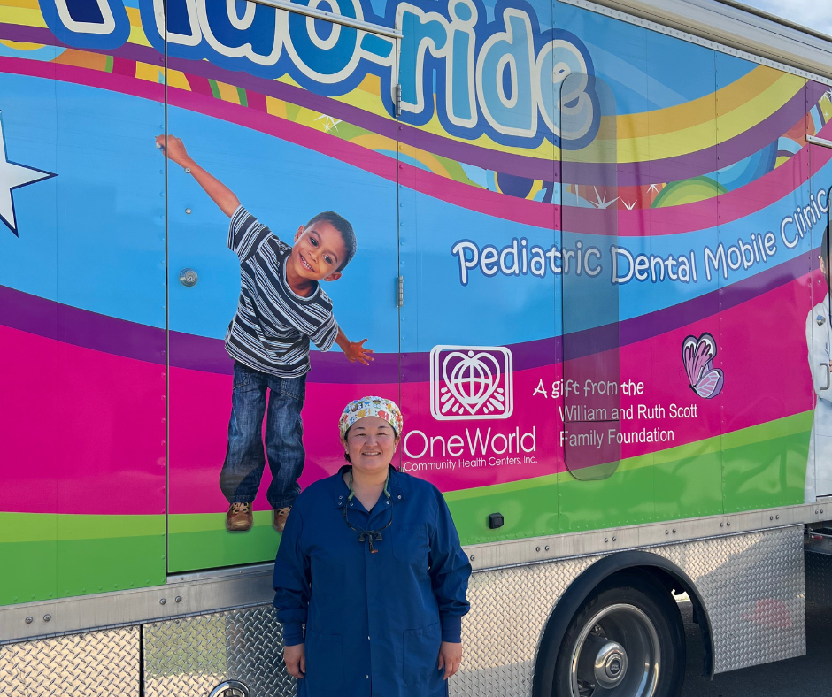 Dr. Houng outside of the Fluo-ride Dental Mobile.