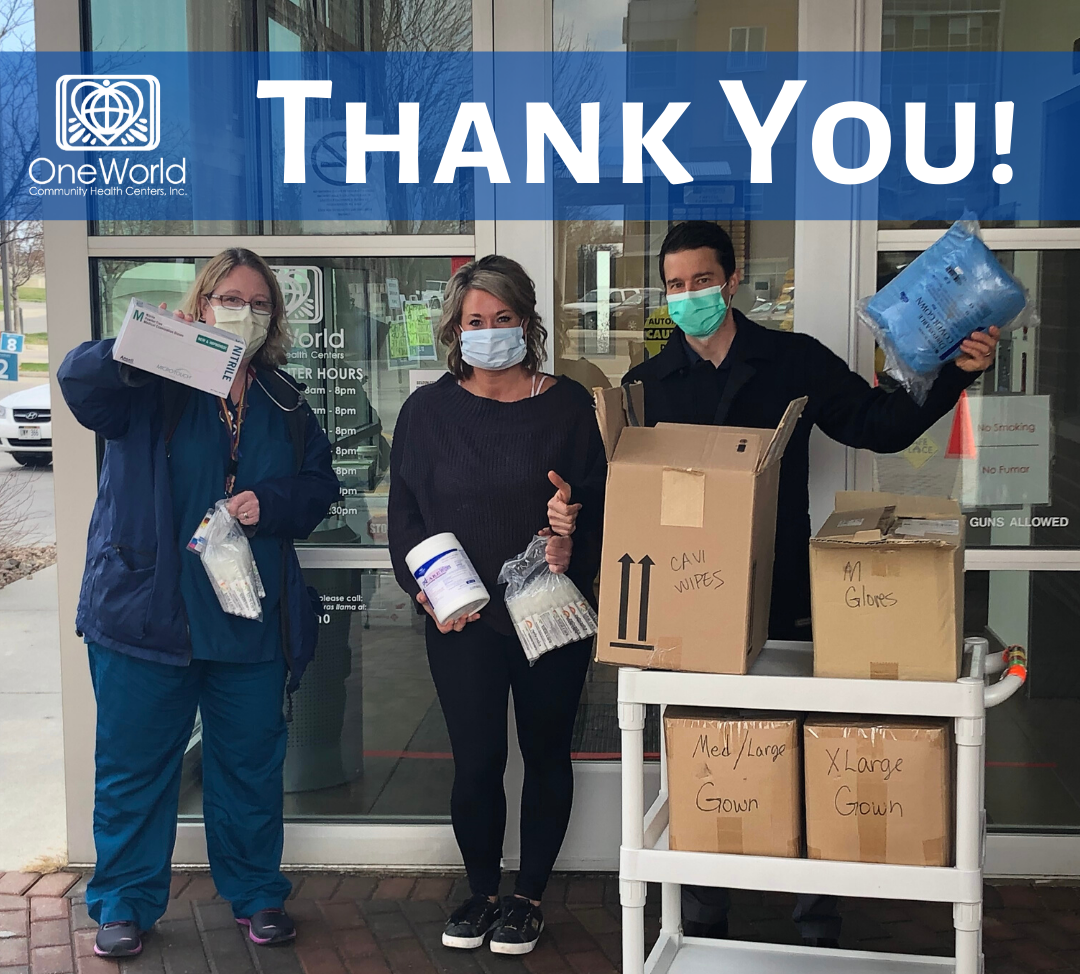 A group of people wearing face masks holding medical supplies