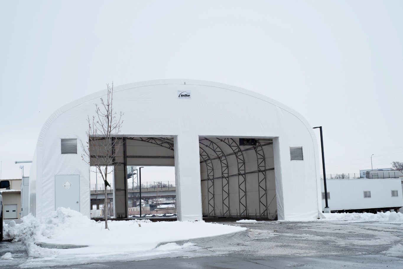 A white building with a door open