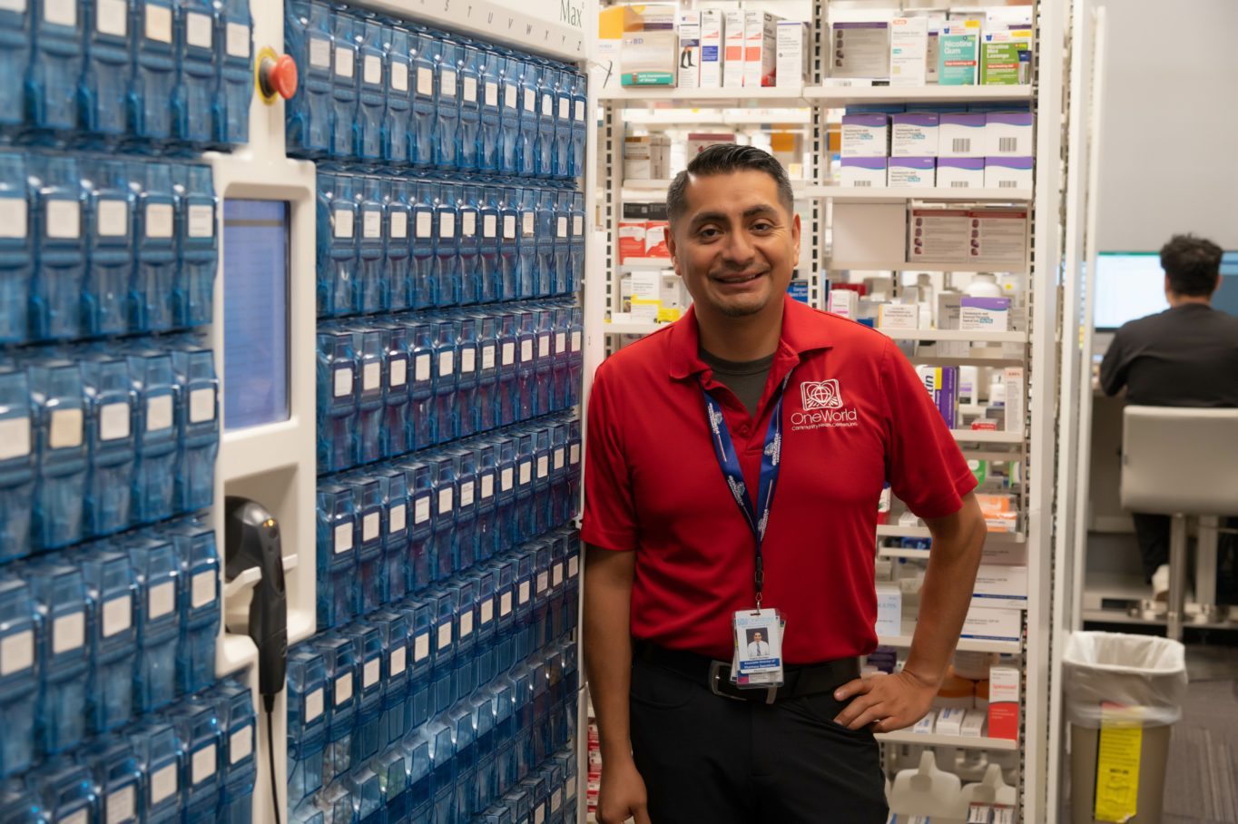 Angelo Garcia, Associate Director of Pharmacy Operations standing in a pharmacy
