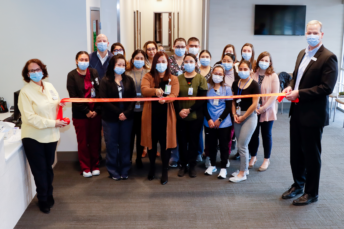 Bellevue staff cutting the ribbon.