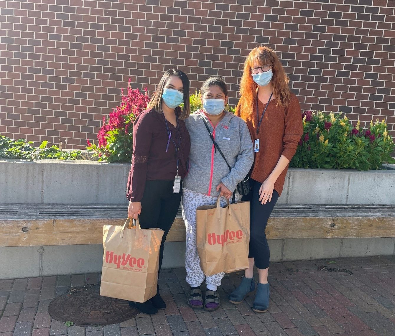 A group of women wearing face masks