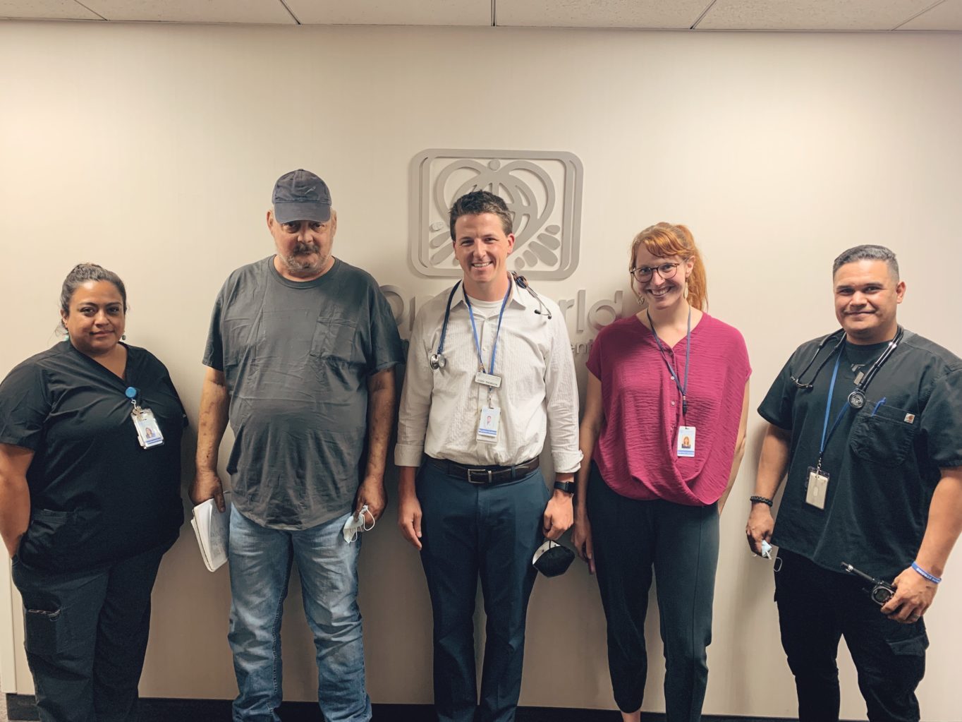 A group of people standing in a room