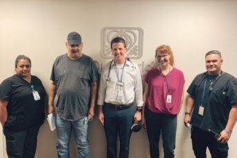 A group of people standing in a room