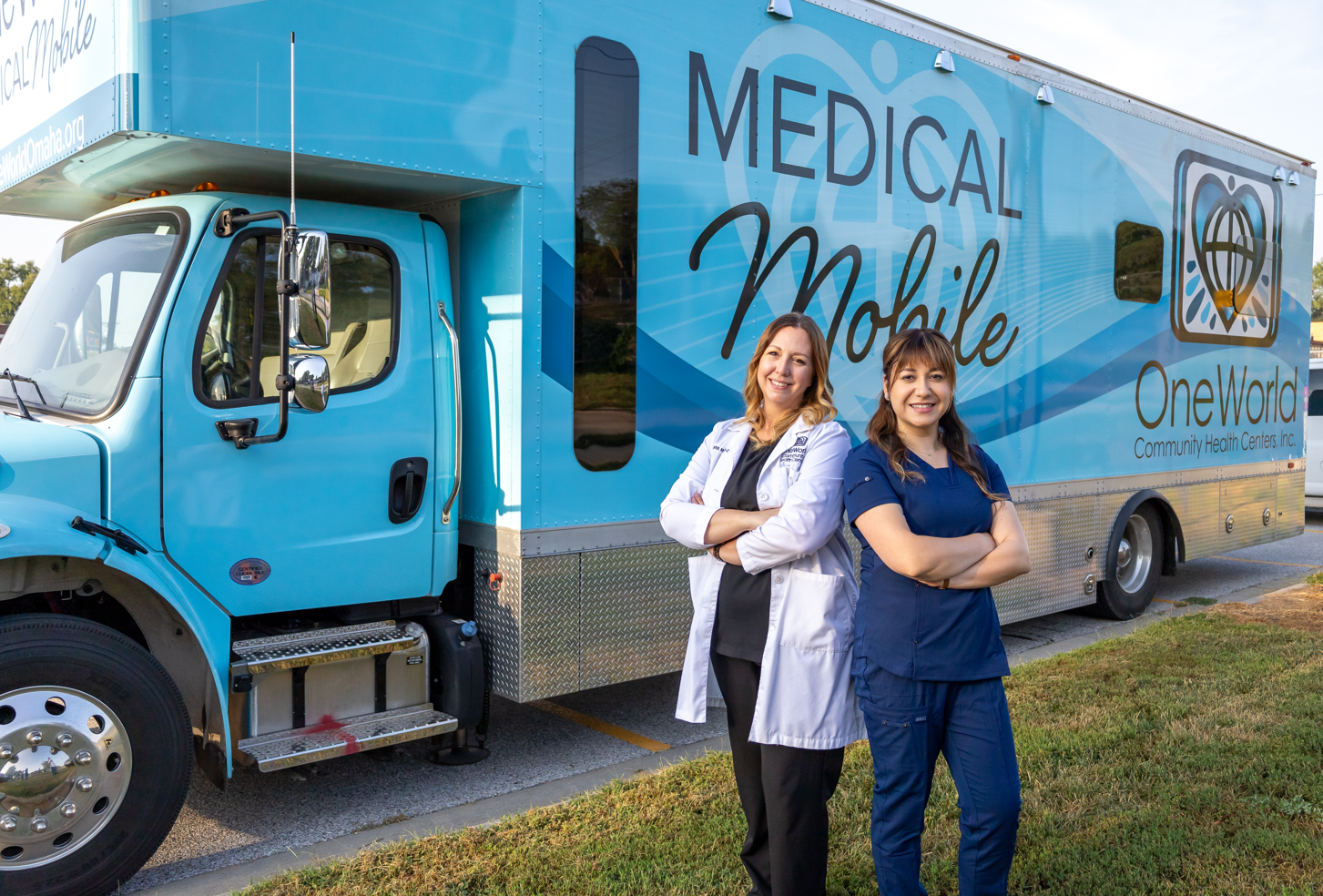 Family Medicine Physician Assistant, Tanya Martin, PA-C, and Health Assistant, Nancy Castillo, standing outside medical mobile smiling.